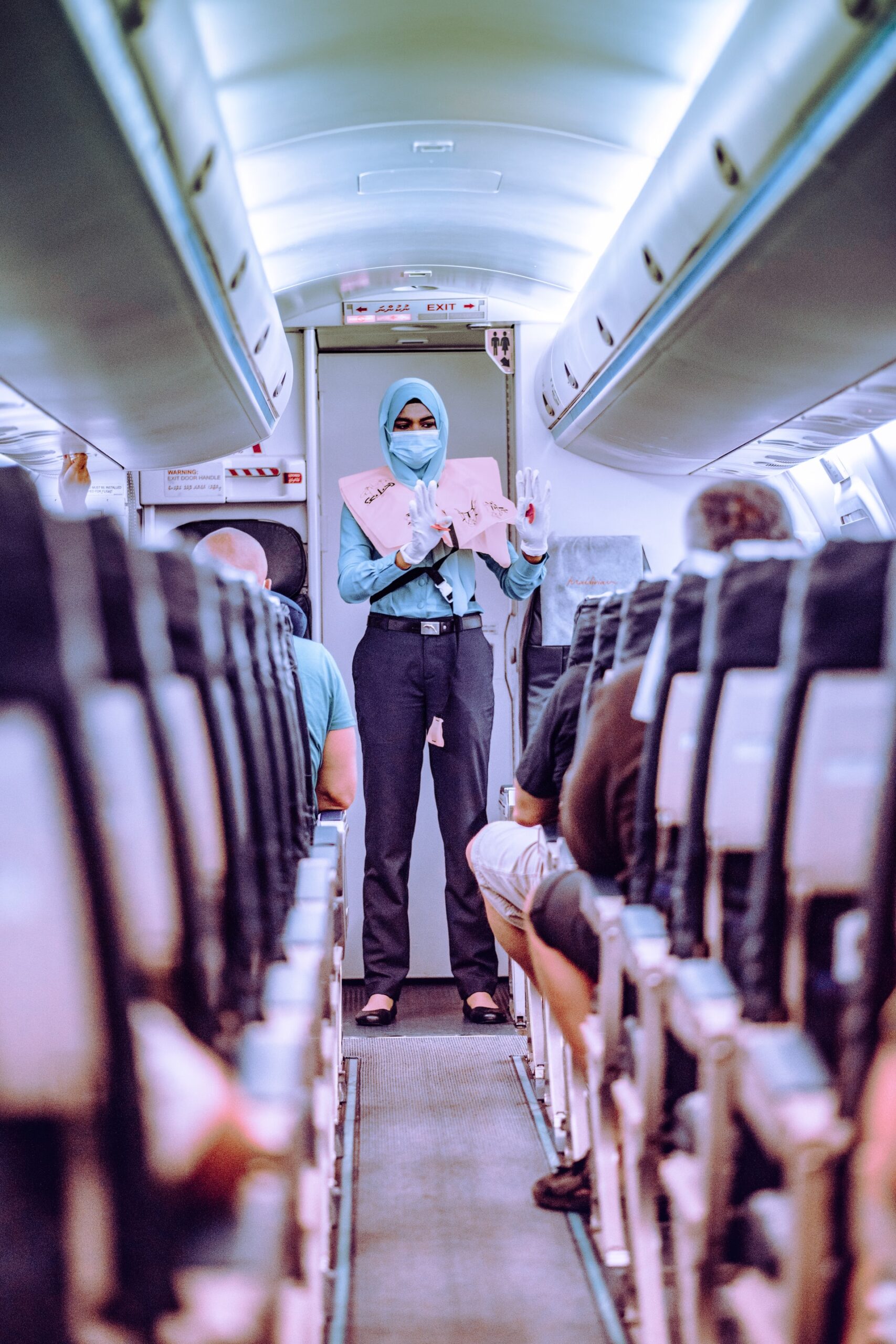 flight attendant wearing a mask